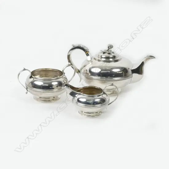 A three-piece crested Irish silver tea set of good weight