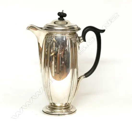 A 1920s silver hot water pot