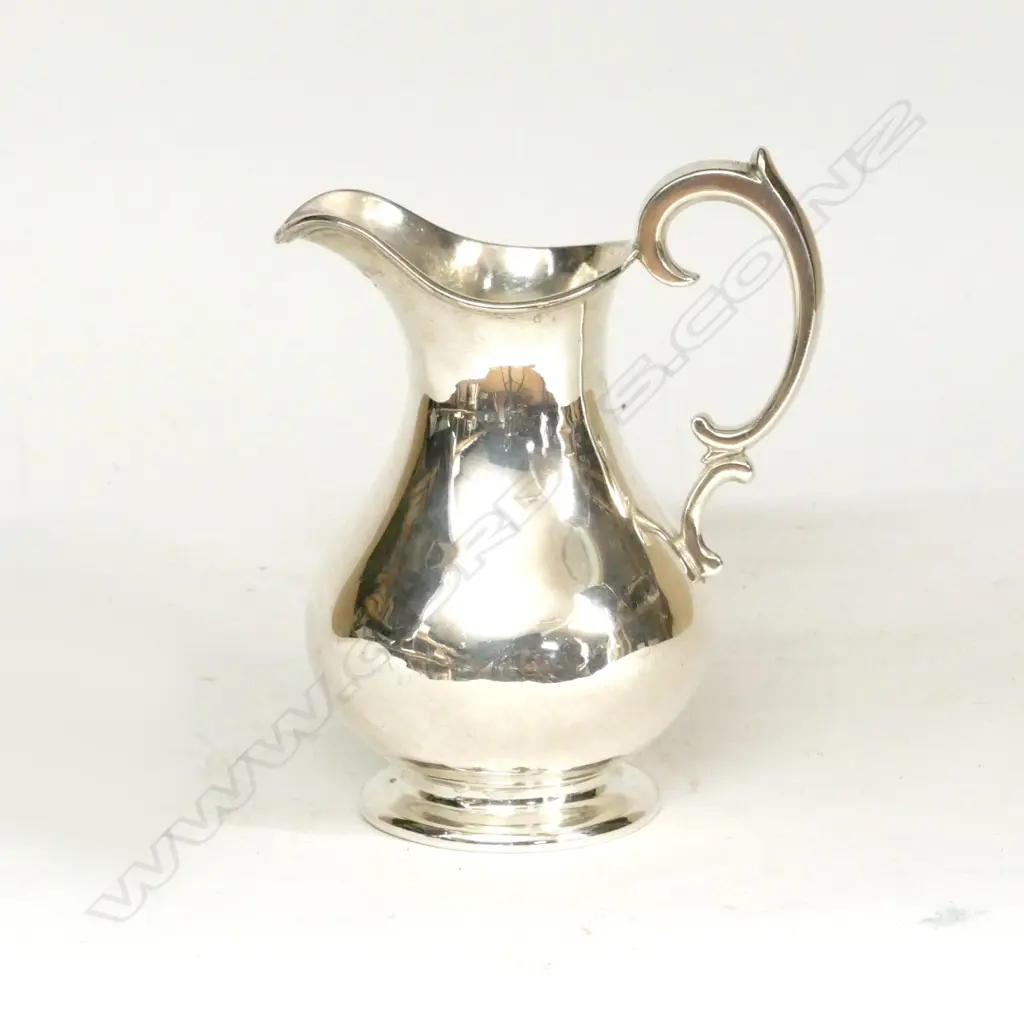 An early Victorian silver cream jug. London 1839 by Edward Image 1++