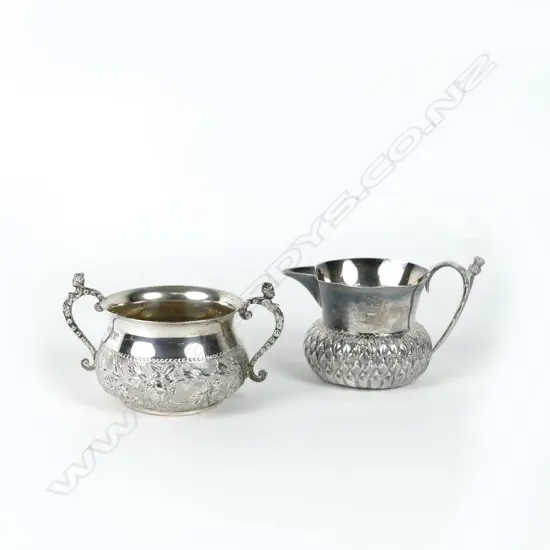 A small two-handled silver sugar basin