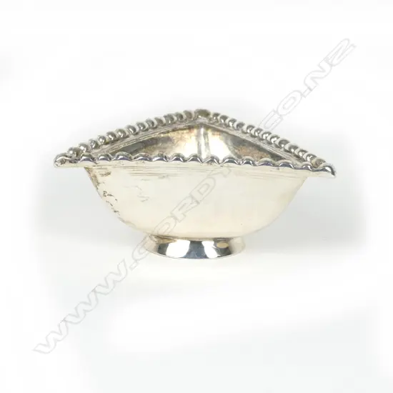 A small heavy Art Deco Scottish silver triangular dish