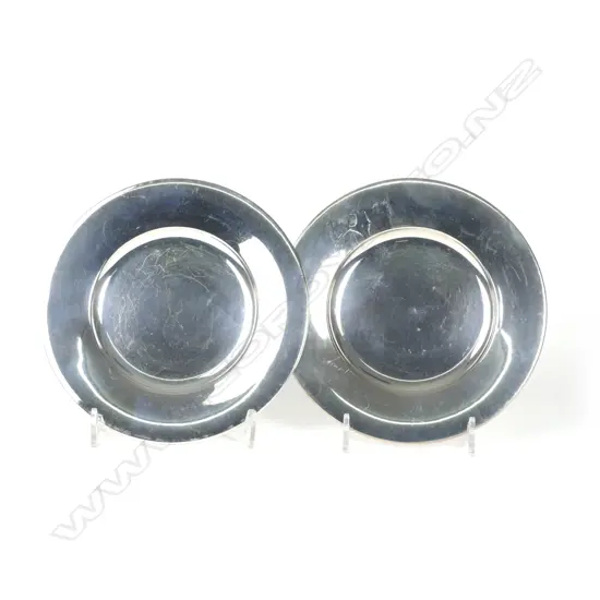A pair of 800 standard silver circular table coasters
