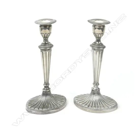 A pair of English silver plated candlesticks