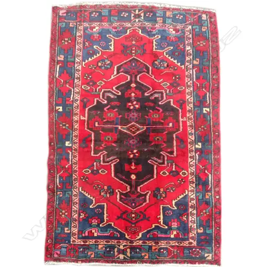 An old hand knotted Persian Hamadan rug