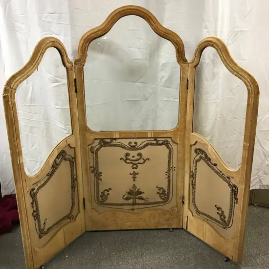 An antique French three-fold glass and velvet screen