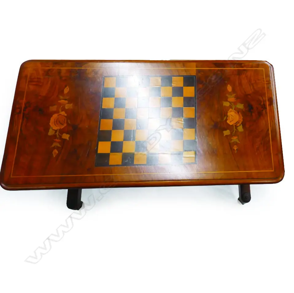A Victorian figured walnut games table of refectory style Image 1++