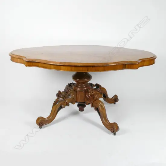 A Victorian walnut serpentine loo table