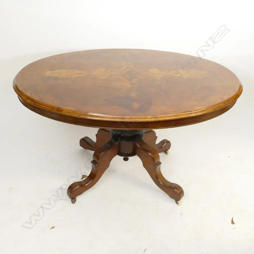 A Victorian walnut loo table Image 1++
