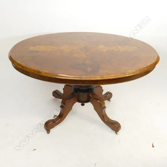 A Victorian walnut loo table