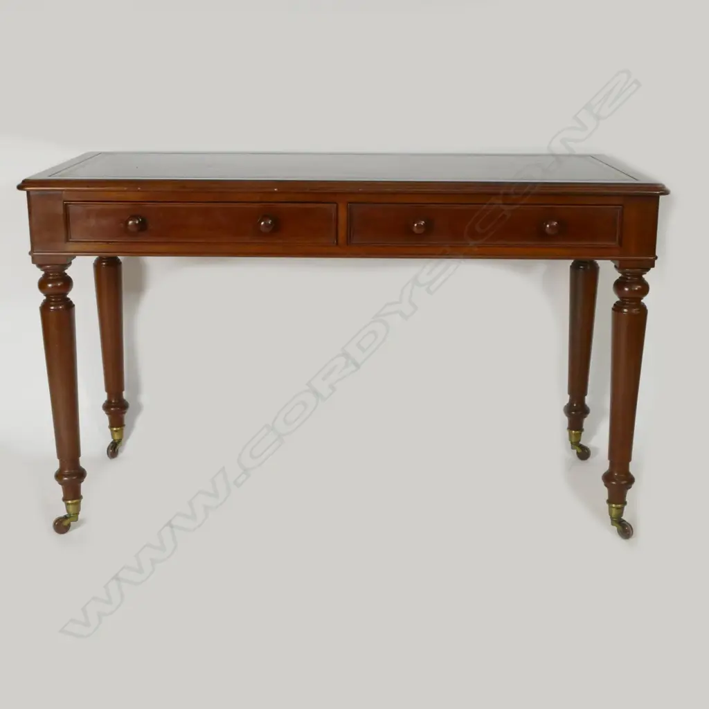 A Victorian mahogany leather topped writing table Image 1++
