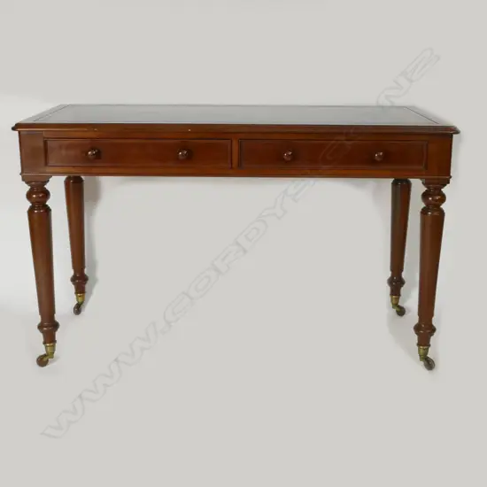 A Victorian mahogany leather topped writing table
