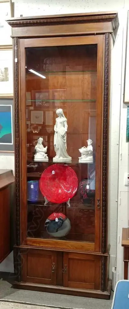 An early 20thC oak tall narrow glazed display cabinet Image 1++