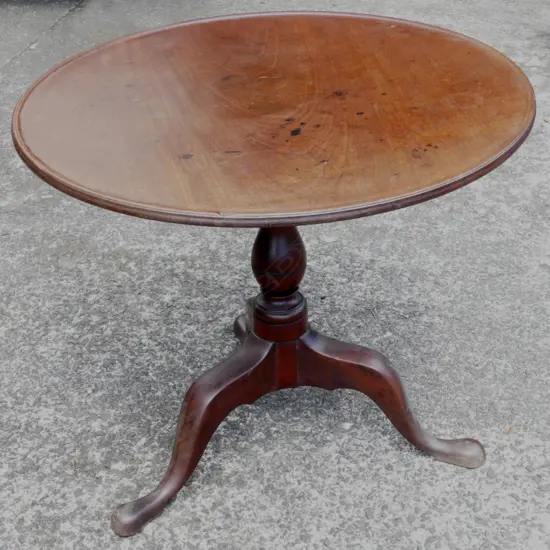 A Georgian mahogany tilt-top tripod wine table