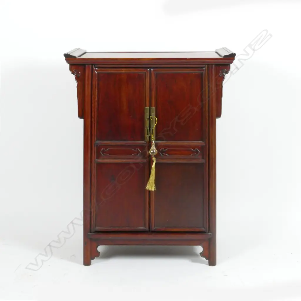 A Chinese teak small two door cabinet Image 1++