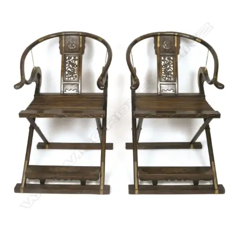 A pair of Chinese hardwood horseshoe-back folding armchairs Image 1++