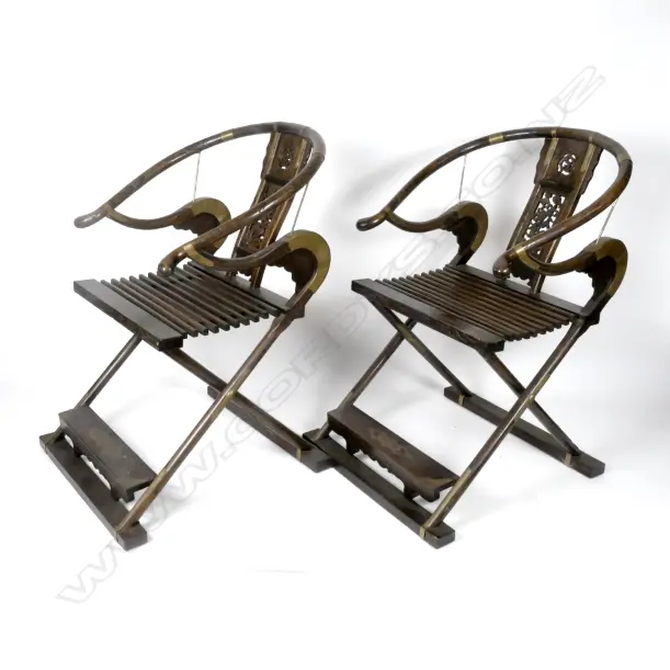 A pair of Chinese hardwood horseshoe-back folding armchairs Image 1++
