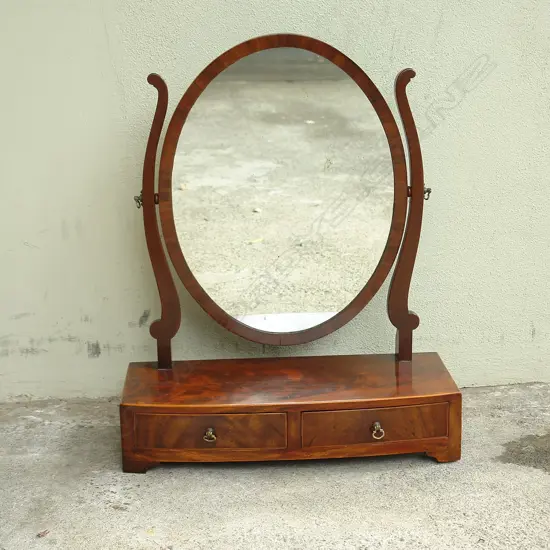 A George III plain mahogany toilet swing mirror