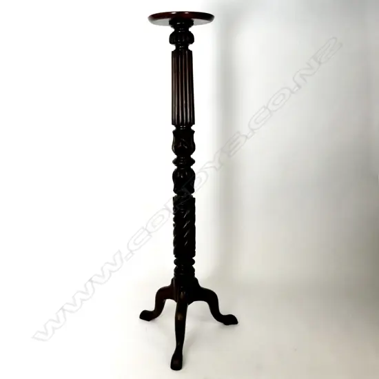 A mahogany torchiere