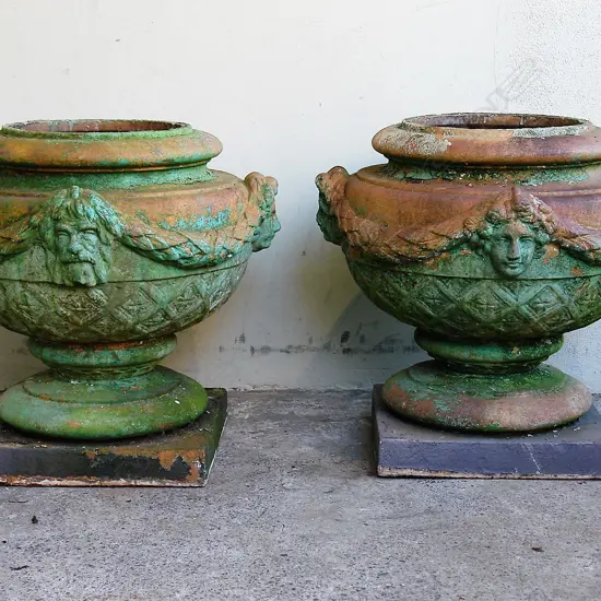 A pair of late 19thC large terracotta classical garden urns