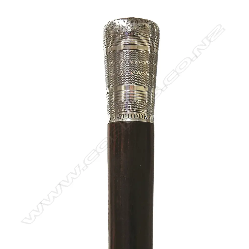 A rosewood and silver walking stick engraved: 'R.J. SEDDON Image 1++