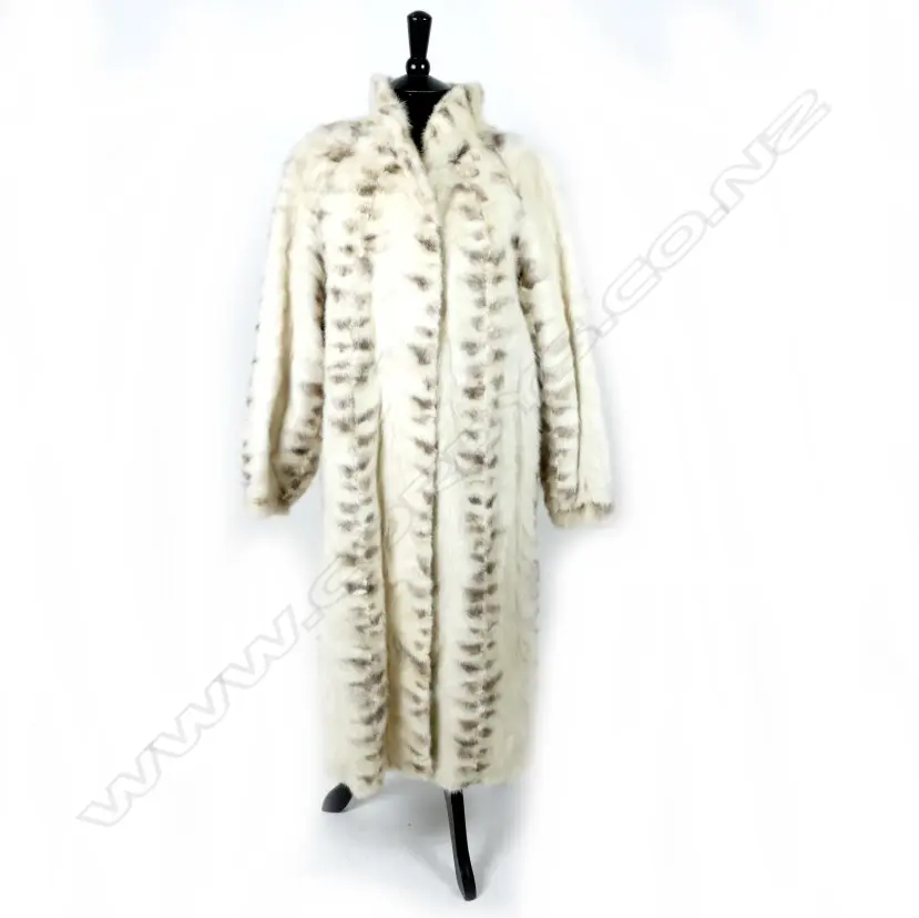A below-the-knee white mink fur coat with brown mink detail in restrained pattern Image 1++