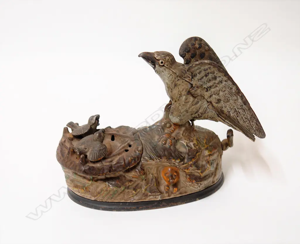 An American 1833 J. & E. Steven's Co. 'Eagle & Eaglets' cast iron mechanical money bank Image 1++