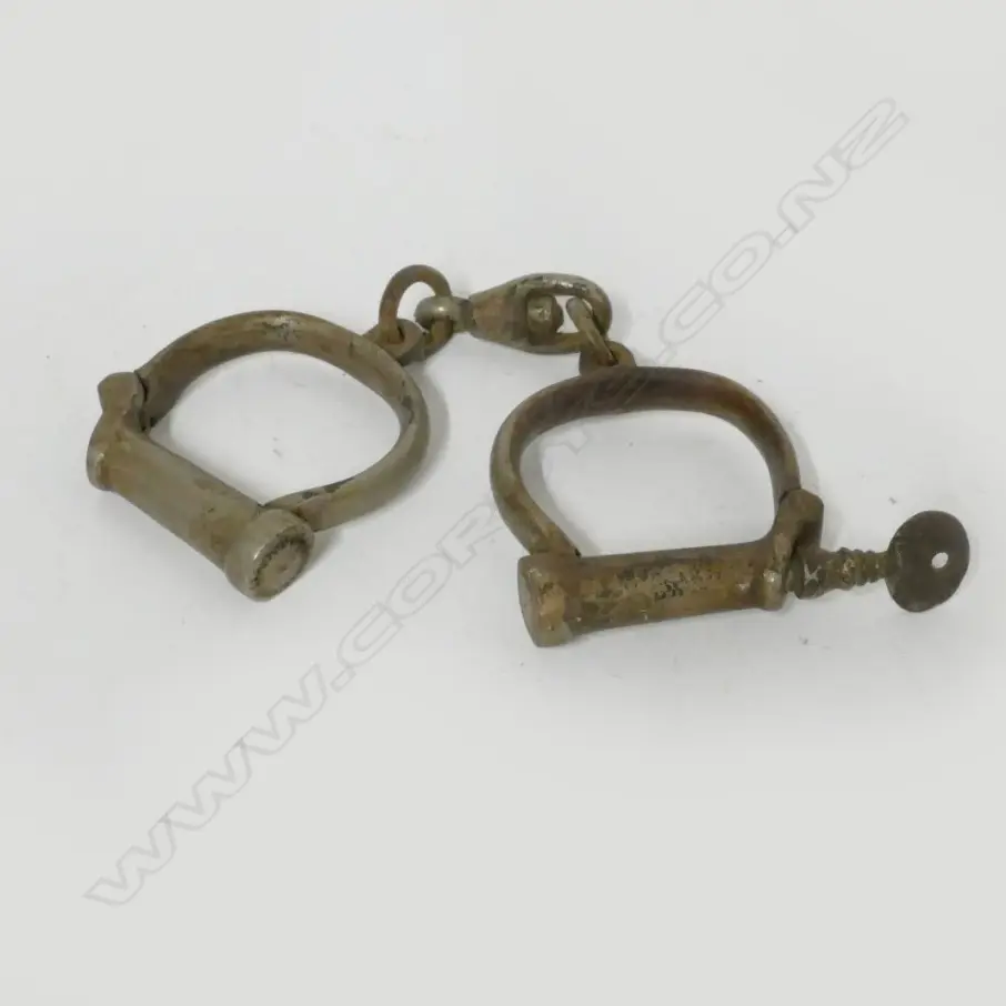 A pair of vintage handcuffs Image 1++
