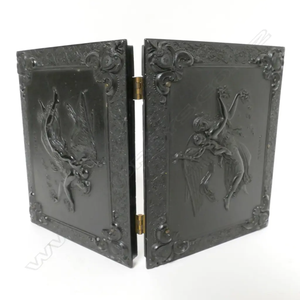 A finely moulded vulcanite box case enclosing two portrait photographs Image 1++