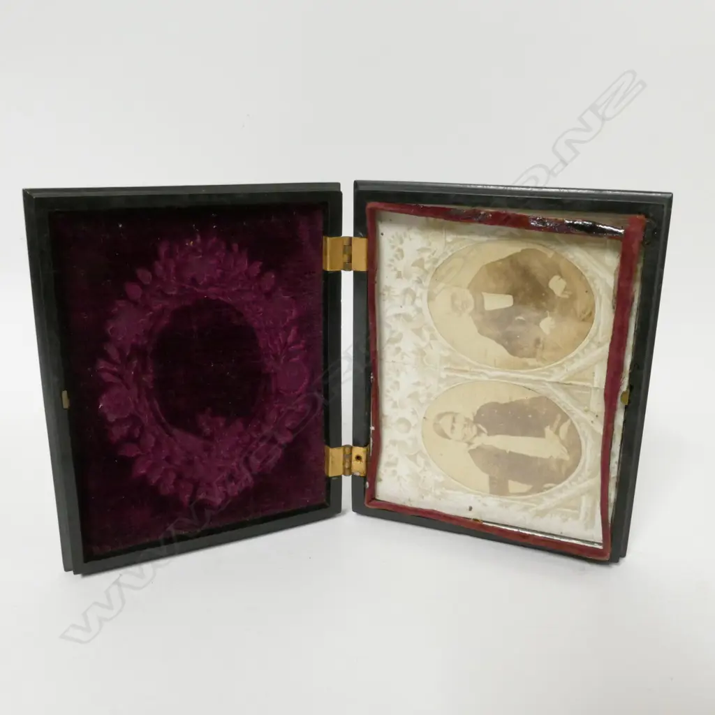 A finely moulded vulcanite box case enclosing two portrait photographs Image 1++