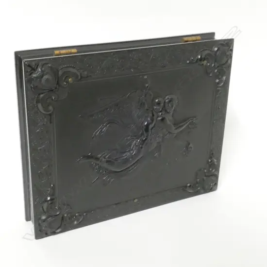 A finely moulded vulcanite box case enclosing two portrait photographs