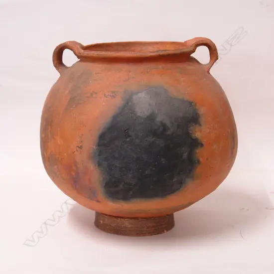 An old terracotta Peruvian spherical vessel