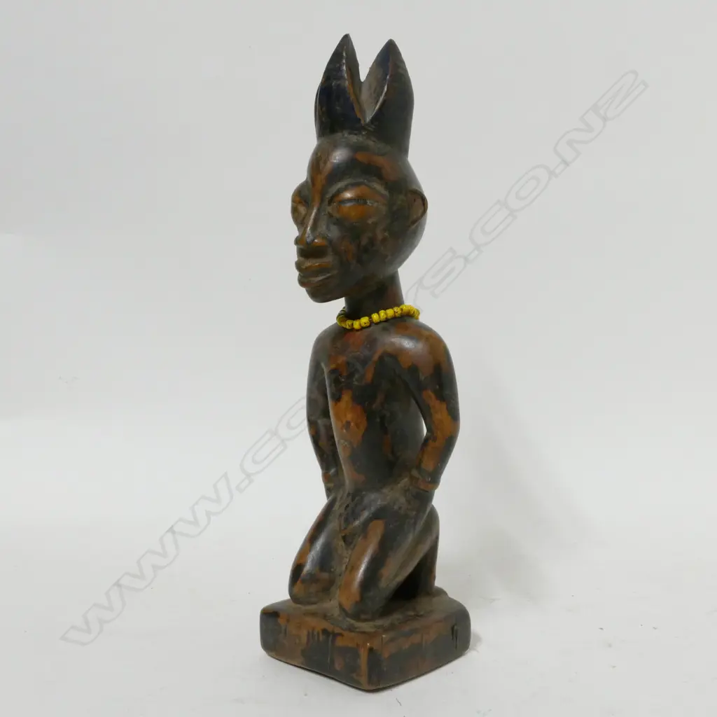 A carved Nigerian Ibedji male figure Image 1++