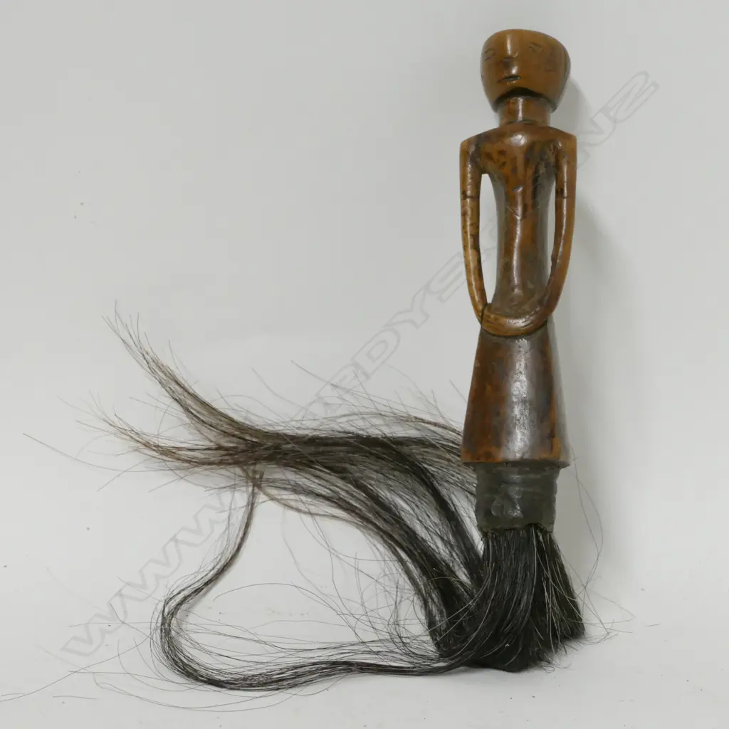 A carved Central African fly whisk Image 1++