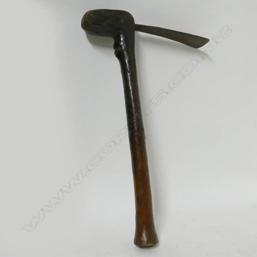 An African metal and wood hoe Image 1++