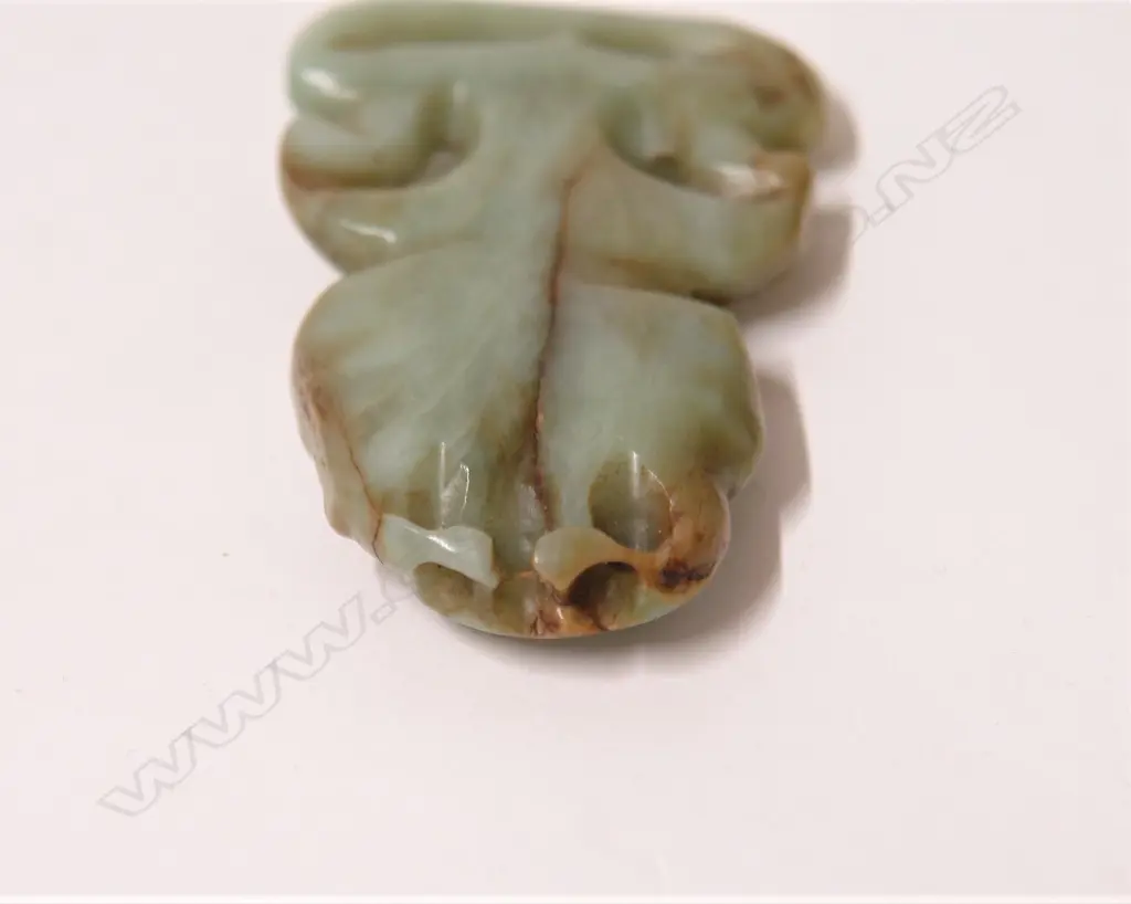 An uncommon pre-European Maori carved inunga pounamu hei tiki Image 1++