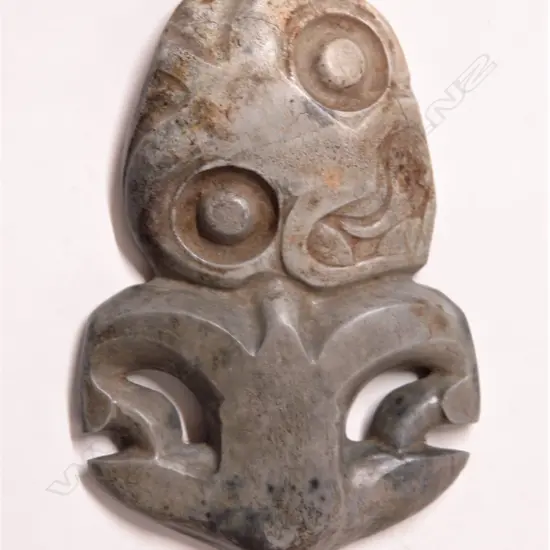 A large pre-European Maori carved pounamu damaged hei tiki