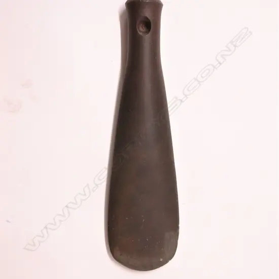 A pre-European Maori patu onewa (stone hand club)