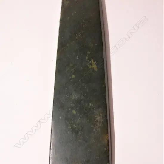 A large and impressive Maori contact period carved pounamu toki (adze blade)