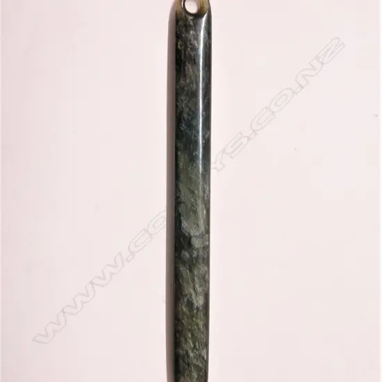 An old Maori carved pounamu (bowenite) long kuru pendant