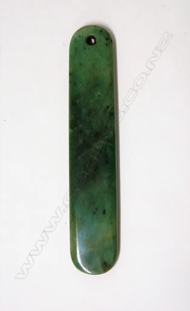 A 20thC large pounamu pendant of long parallel form Image 1++
