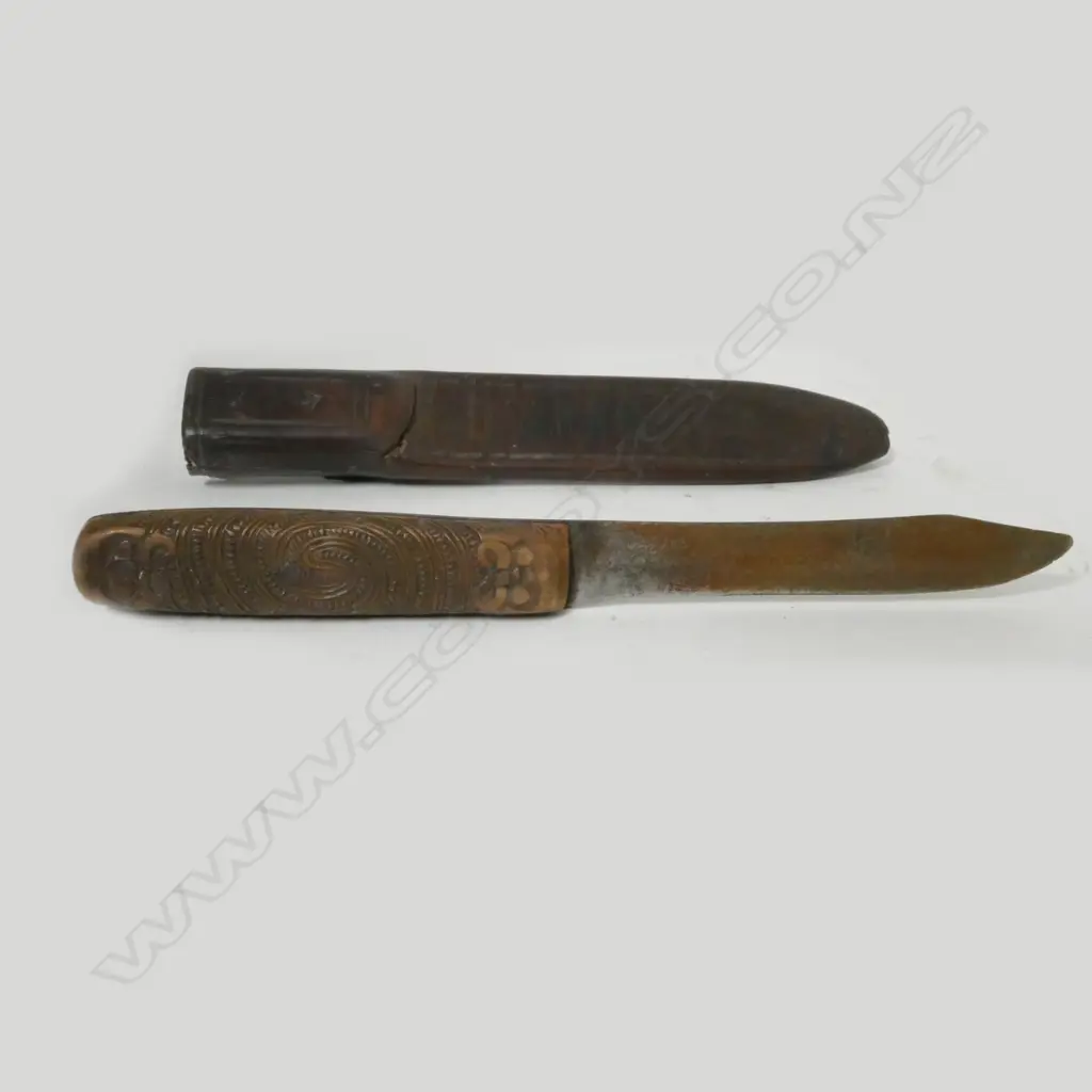 A sheath knife with Maori carved wooden handle Image 1++