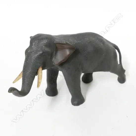 A Japanese Meiji period bronze standing elephant calf