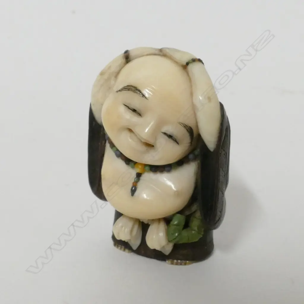 A good Tokyo school tagayasan wood and ivory netsuke of Hotei attributed to Suzuki Tôkoku [Bairyû] (1845-1913) Image 1++