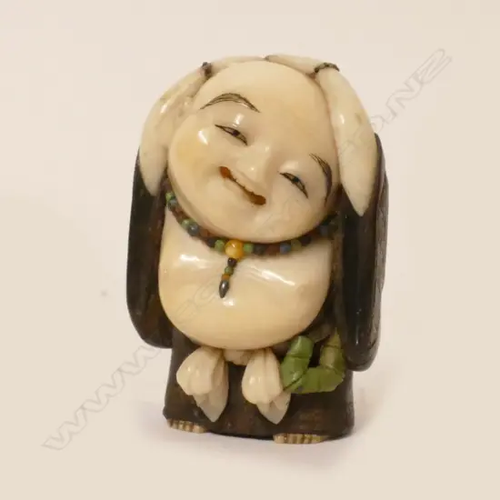 A good Tokyo school tagayasan wood and ivory netsuke of Hotei attributed to Suzuki Tôkoku [Bairyû] (1845-1913)