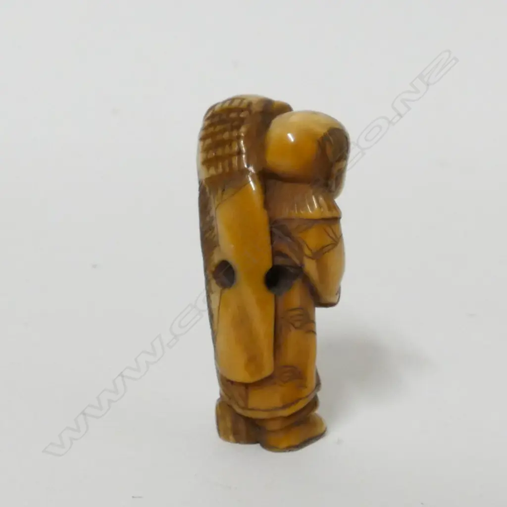 A small old ivory netsuke of a shishimai dancer Image 1++