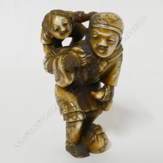 A Japanese small ivory okimono