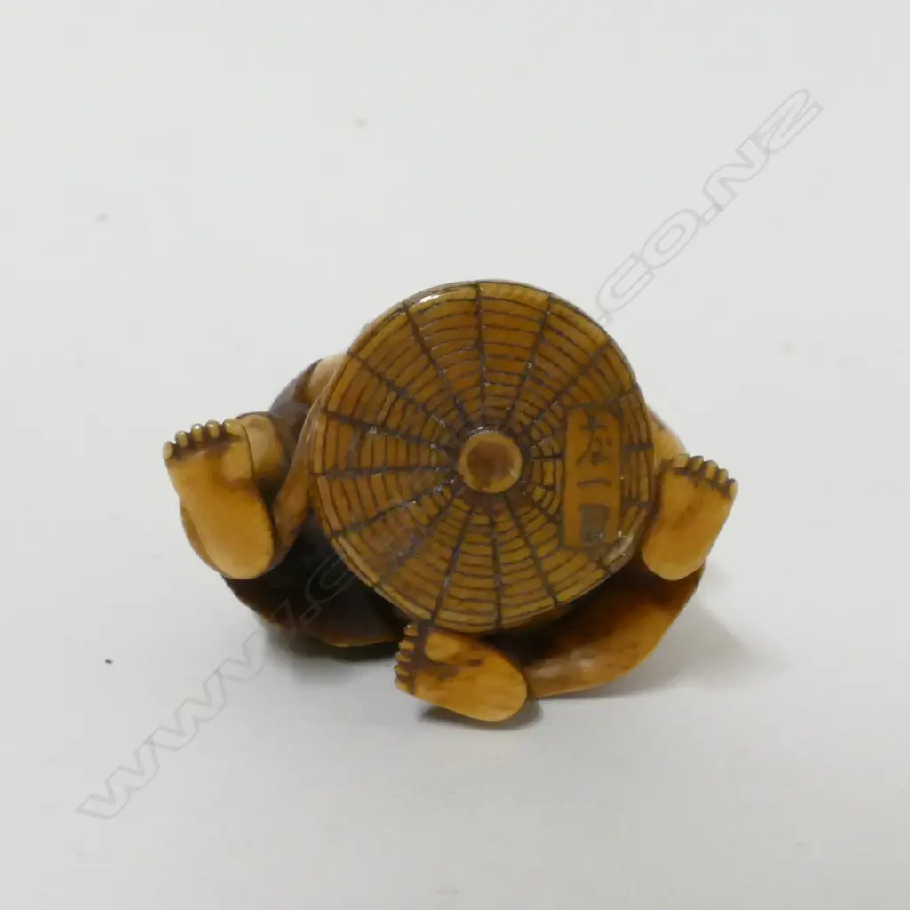 A small 19thC ivory okimono Image 1++