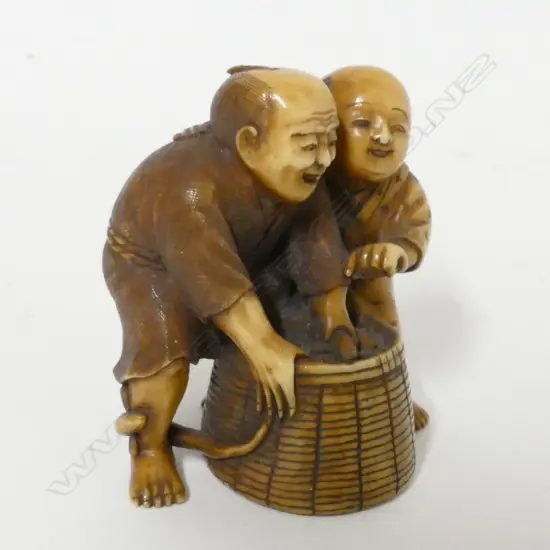 A small 19thC ivory okimono