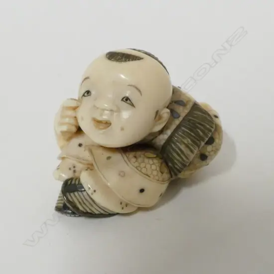 A good Tokyo school ivory and shibayama netsuke of a young boy