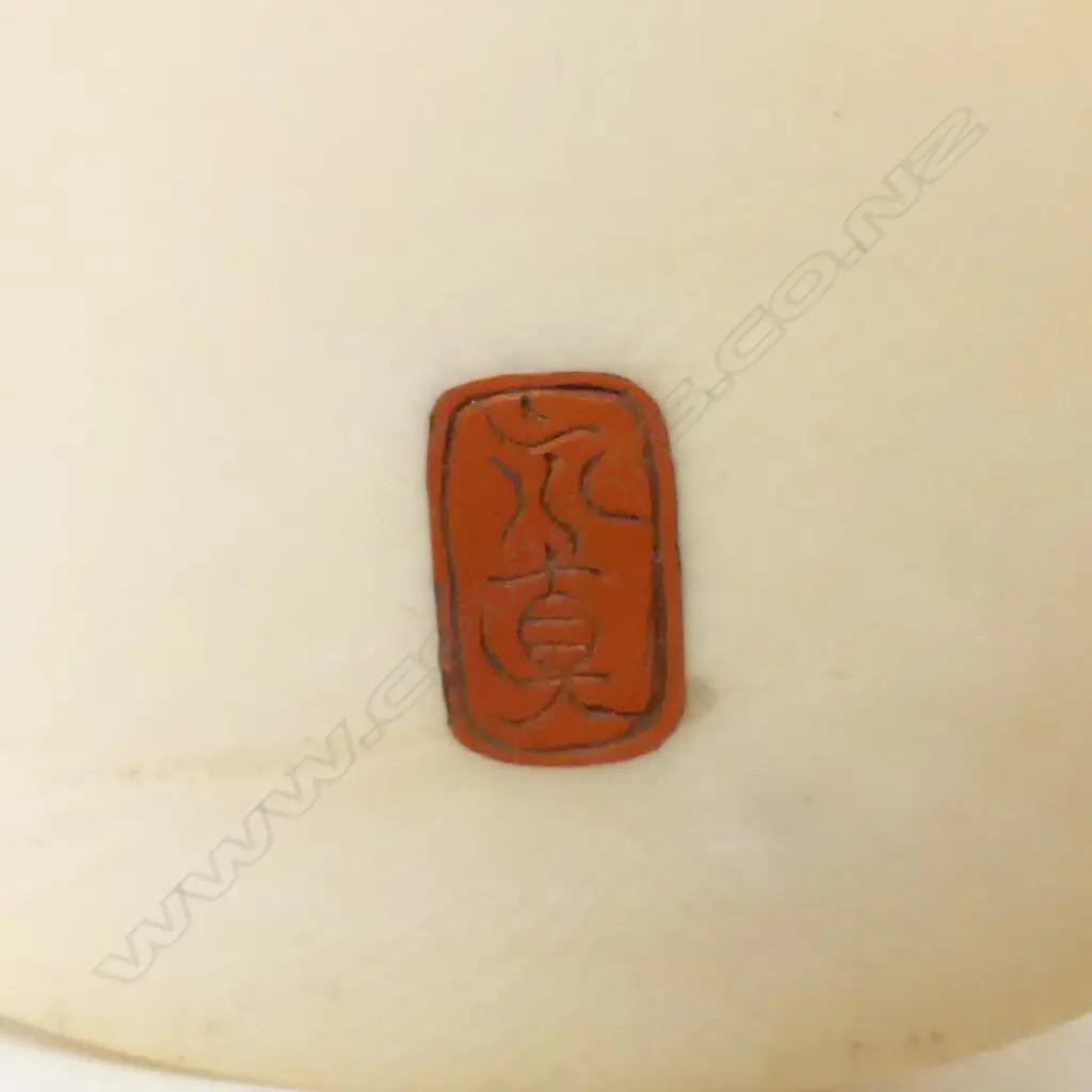 A Japanese Meiji period ivory okimono of a drum and basket seller Image 1++
